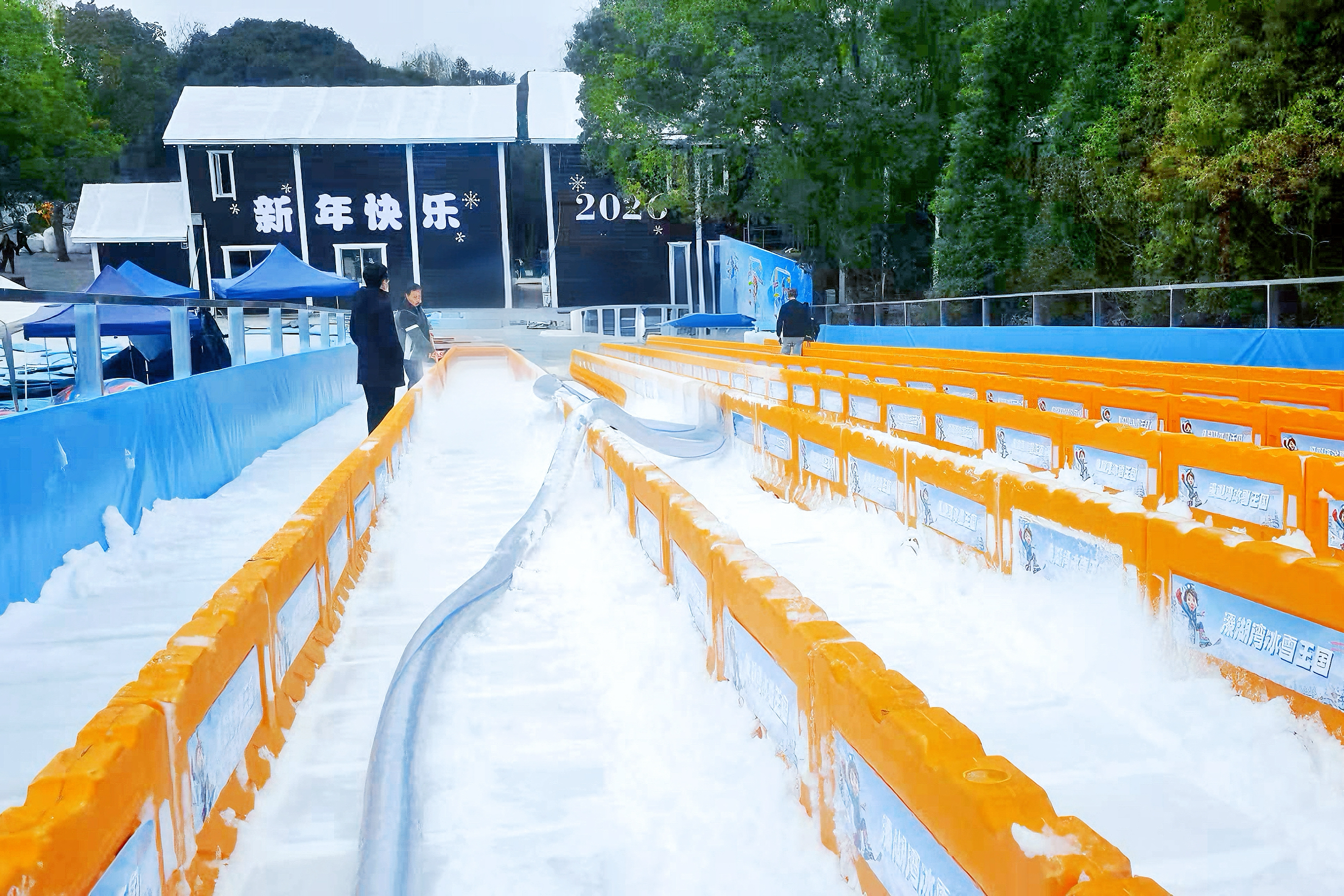 Commercial snow making machine spraying artificial snow for outdoor snow park