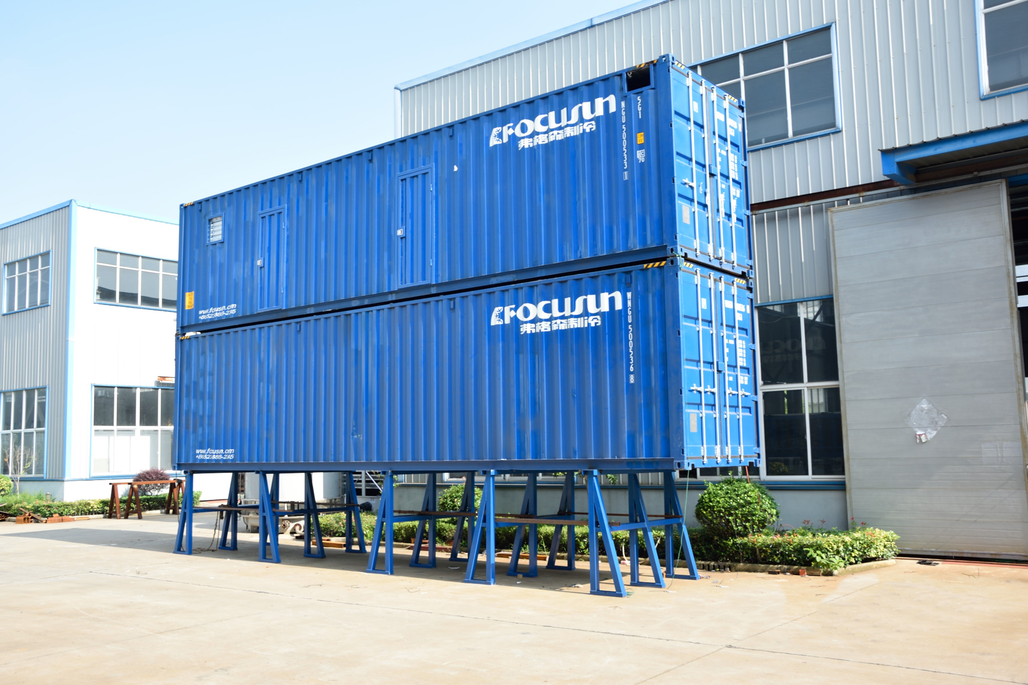 A containerized flake ice machine paired with an automatic rake-type ice storage