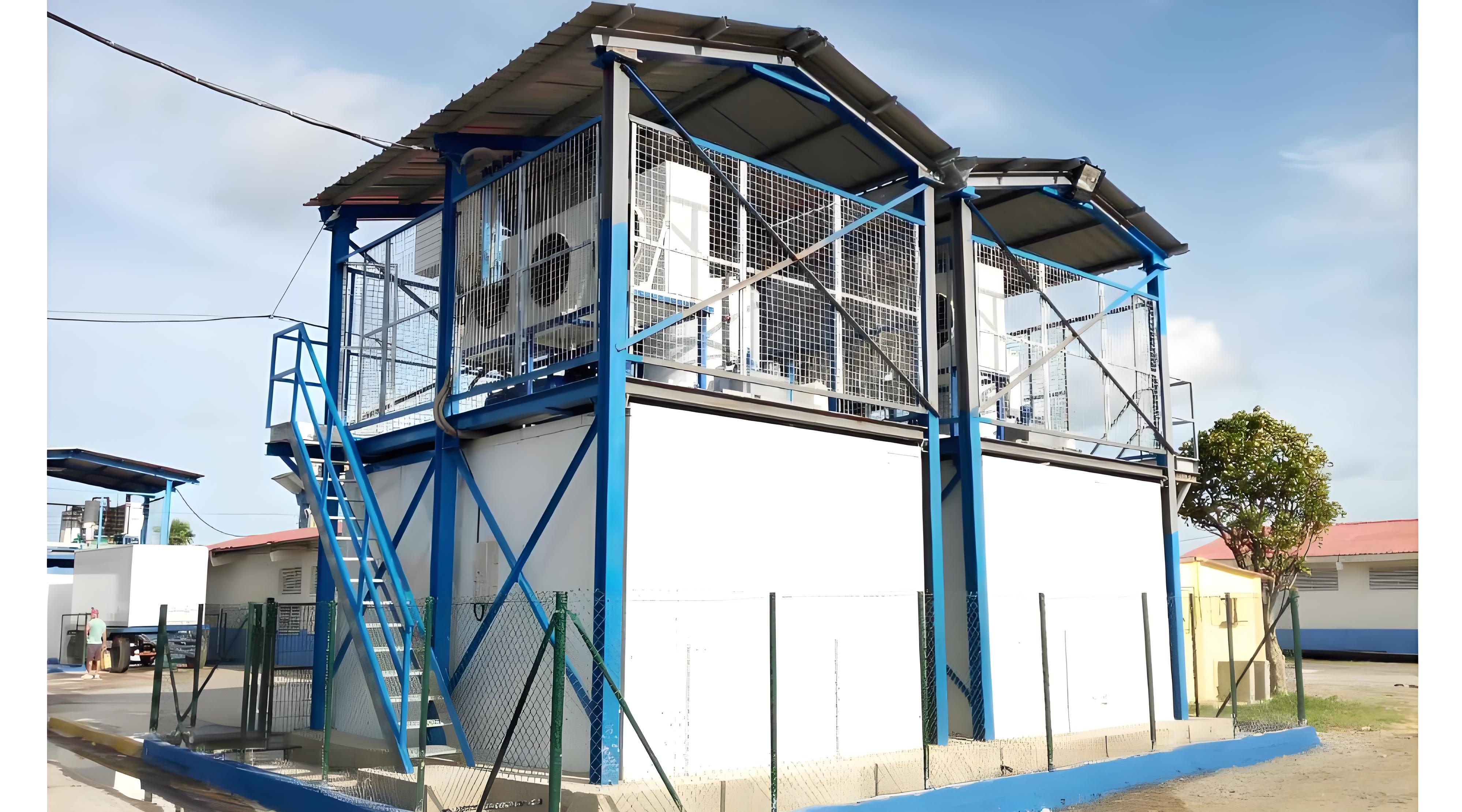 Flake ice machine integrated with cold storage for concrete cooling applications