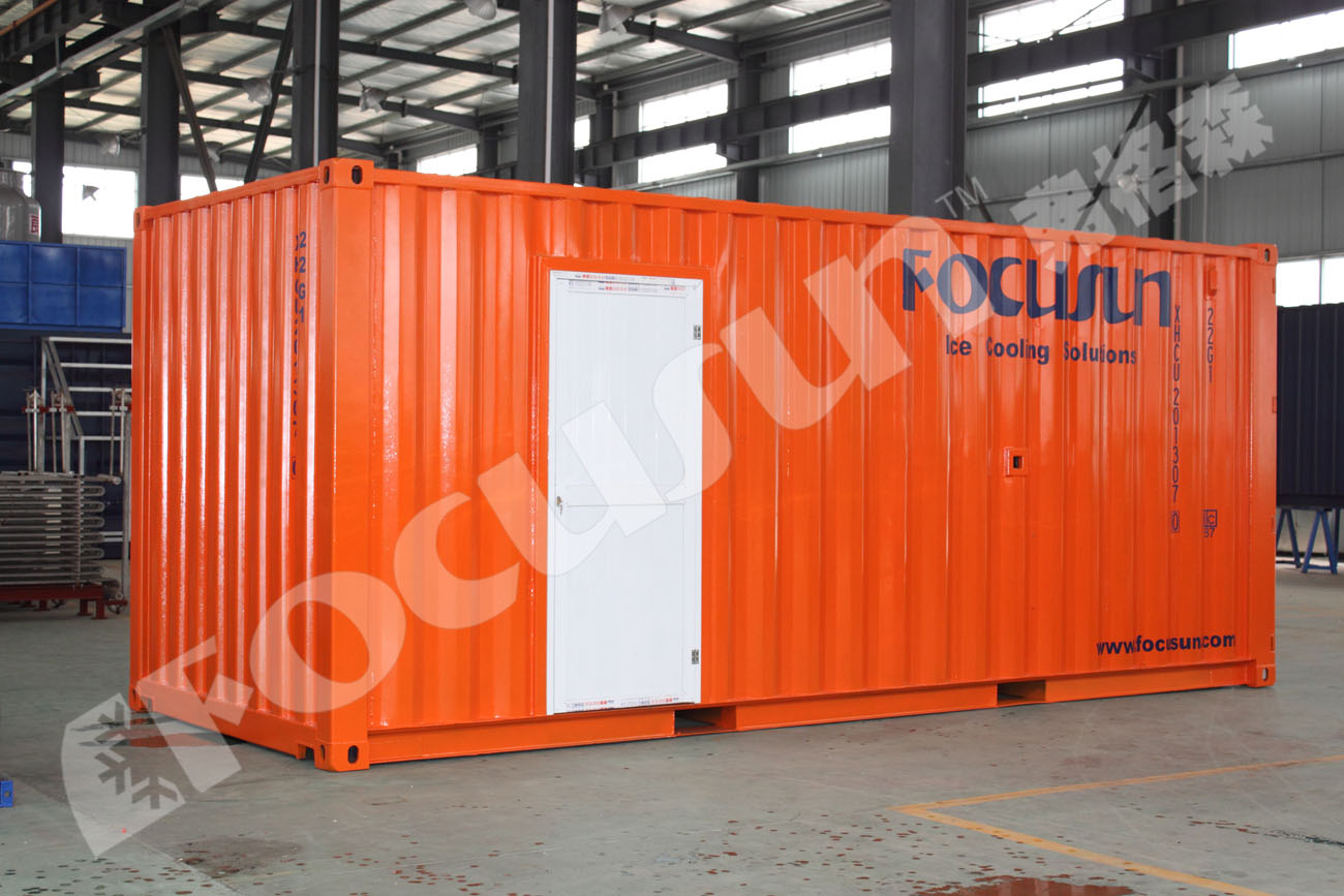 Containerized flake ice machine deployed at a remote construction and concrete cooling site